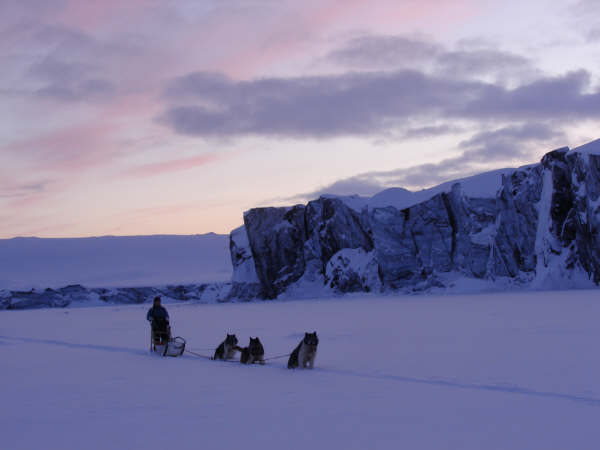 097 Sledging along the glacier wall